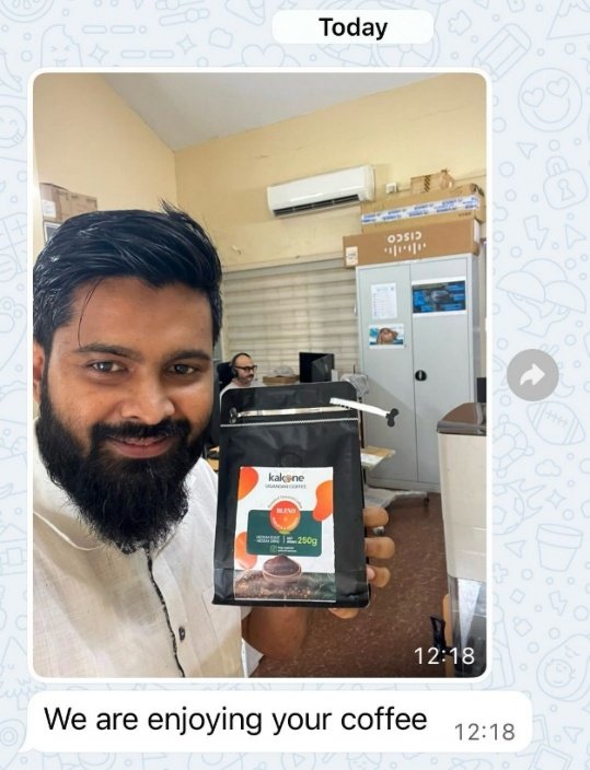 A Kakone Coffee customer holding a bag of Kakone Blend coffee, sharing feedback that they are enjoying it